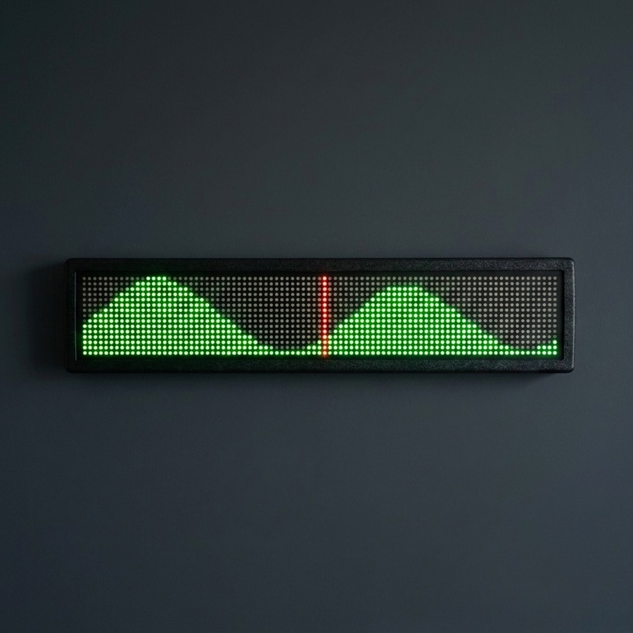 LED display showing a green tide graph